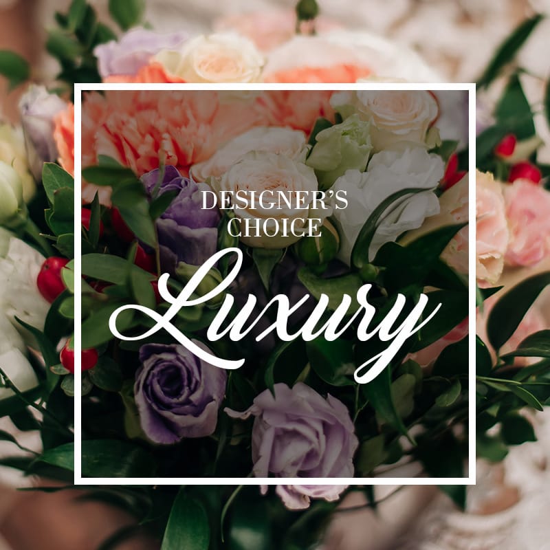 A 'Designer's Choice' luxury bouquet with soft purple roses, peach carnations, and white lisianthus by Grace & Blooms, your Naples florist for custom flower delivery in Talis Park.