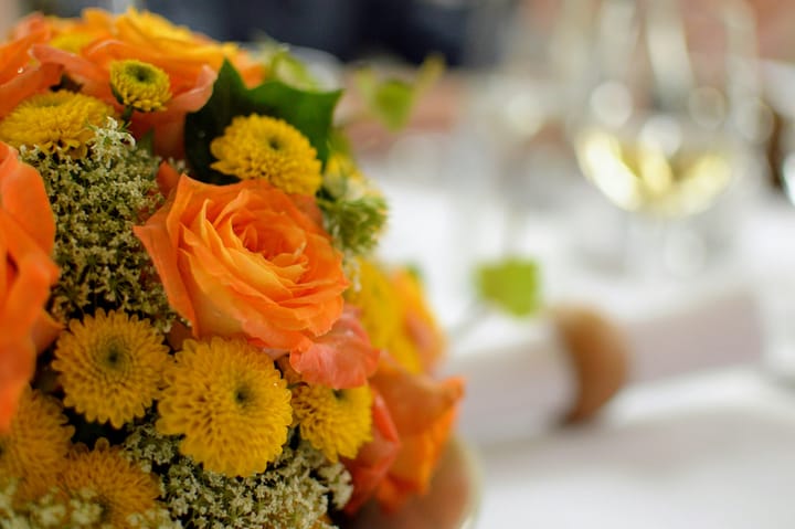 Grace & Blooms Naples florist design for Thanksgiving, showing how coastal palettes and vertical structure create an inviting entry; Naples flower delivery for seasonal hosting.